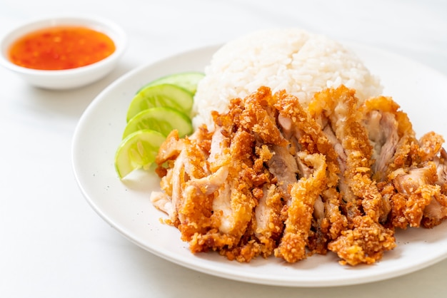 Hainanese chicken rice with fried chicken or rice steamed chicken soup with fried chicken