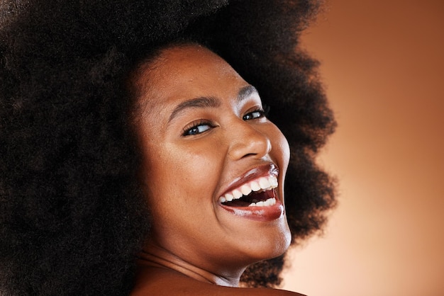 Hair care black woman and beauty with smile afro and dental health white teeth and healthy oral Happy cosmetic and skin health of a person with an afro with happiness or content face with joy