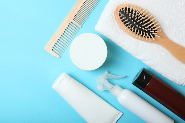 Hair care products and comb on the table top view