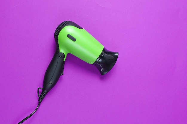 Hair dryer on a purple background