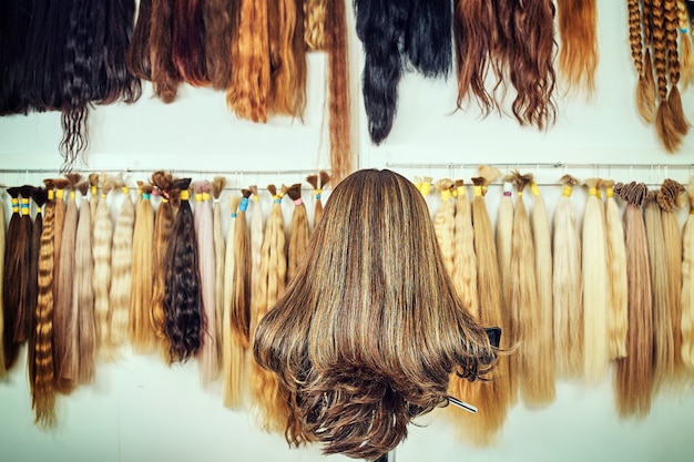 Hair extension equipment of natural hair. hair samples of different colors