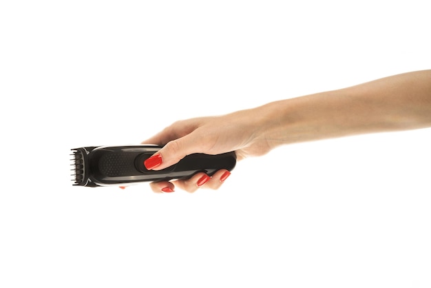 Hair trimmer in hand isolated on the white background