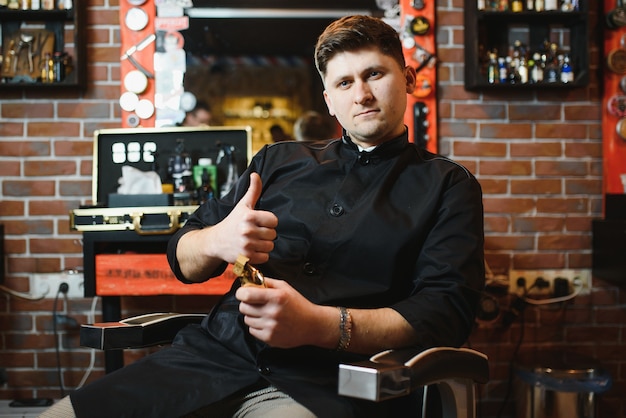 Hairdresser in barbershop chair with tools