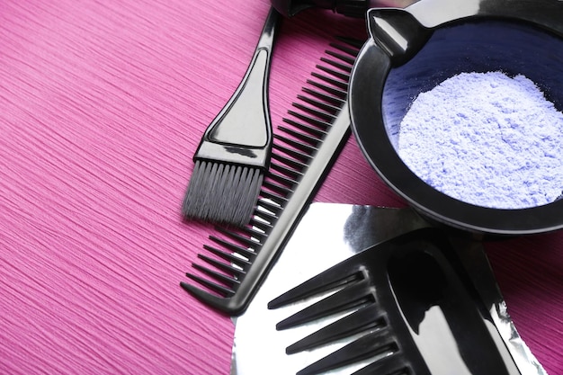 Hairdresser set with various accessories on violet background