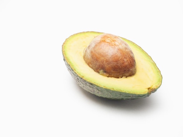 A half of an avocado on a white background