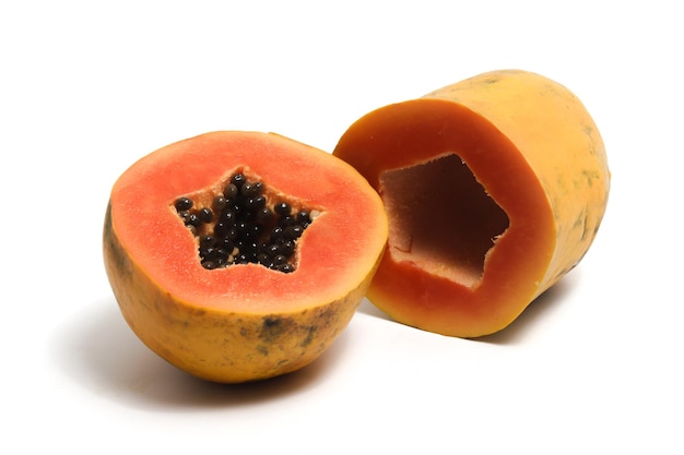 Half cut sliced fresh organic papaya delicious fruit isolated on white background clipping path