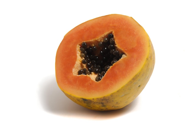 Half cut sliced fresh organic papaya delicious fruit isolated on white background clipping path