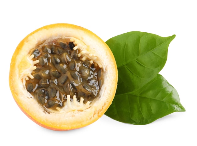 Half of delicious granadilla with leaves isolated on white