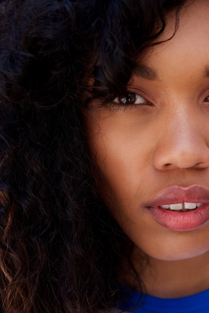 Half face portrait of african woman