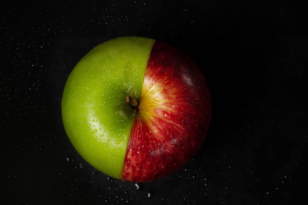 Half green apple and half red apple top view