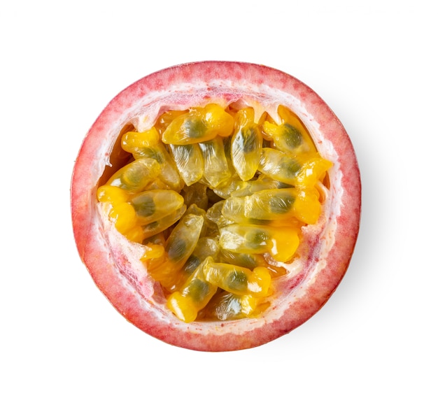 Half passion fruit on white background. top view