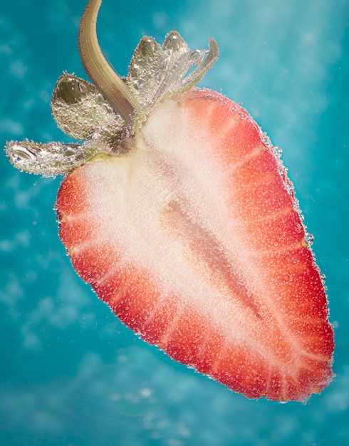 Half of red ripe strawberry with a bubble