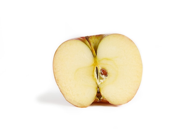 Half red-yellow apple on a white background