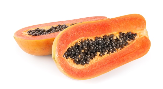 Half of ripe papaya fruit with seeds isolated on white background