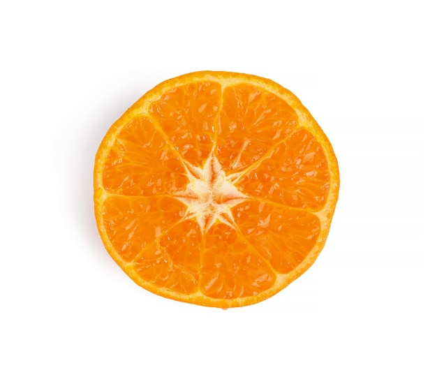 Half ripe tangerine isolated on white wall, top view