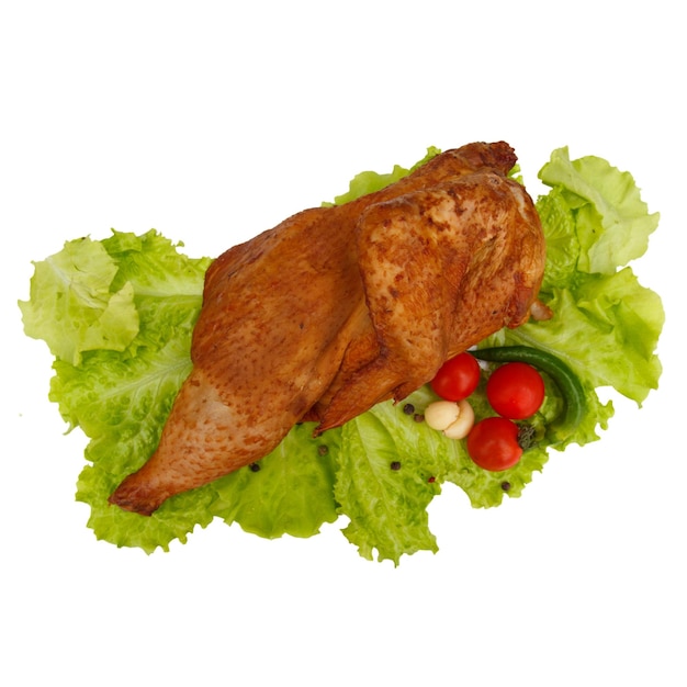 Half smoked chicken on lettuce leaves tomatoes green peppers garlic