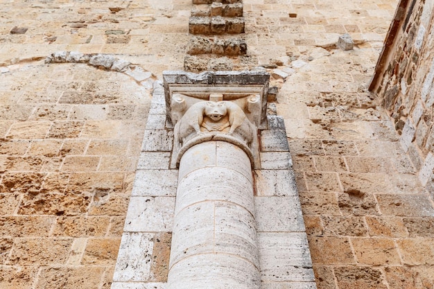 Halfcolumn capital in the abbey depicting a mystical animal in Abbey Sant Antimo Val d'Orcia Italy