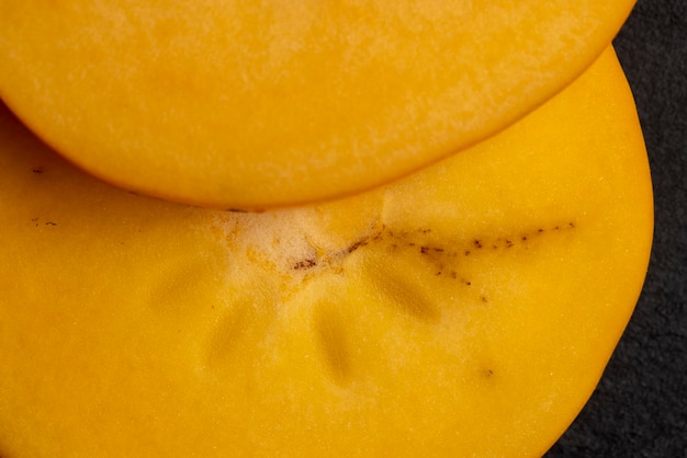 Halfcut ripe and sweet persimmon details of the pulp of ripe persimmon