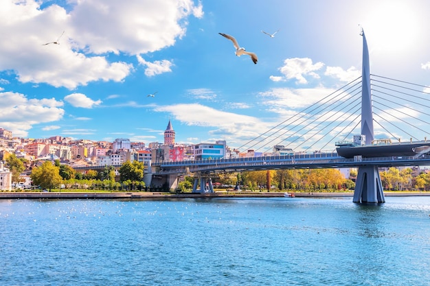 Halic Metro Bridge and Galata Tower on the background view from the Golden Horn Istanbul Turkey