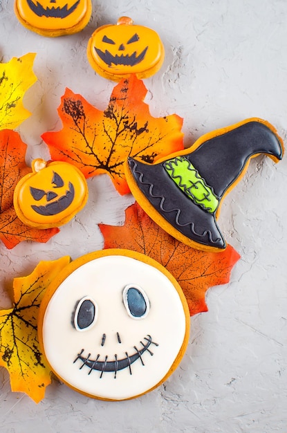 Halloween background with cookies pumpkin leaves