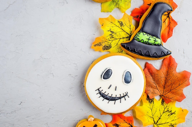 Halloween background with cookies pumpkin leaves