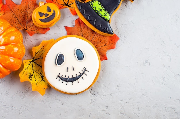 Halloween background with cookies pumpkin leaves