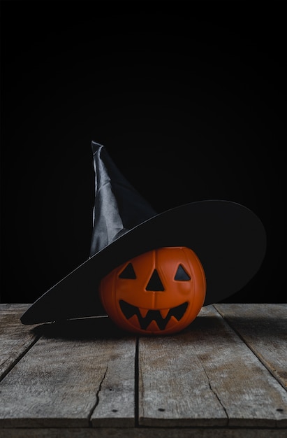 Halloween background with Pumpkins, Witch hat on wooden floor