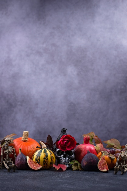 Halloween composition with autumn fruits