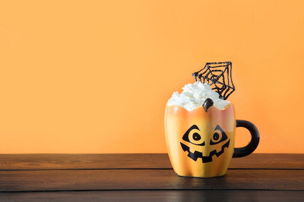 Halloween cup of coffee with whipped cream