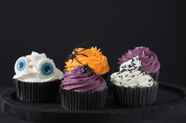 Halloween cupcakes with buttercream and holiday decoration. Halloween creative food