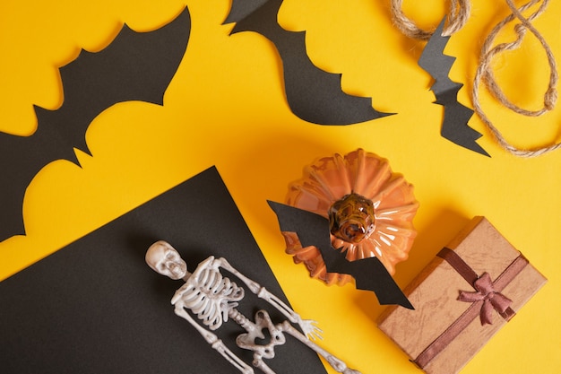 Halloween decor and gift boxes on yellow