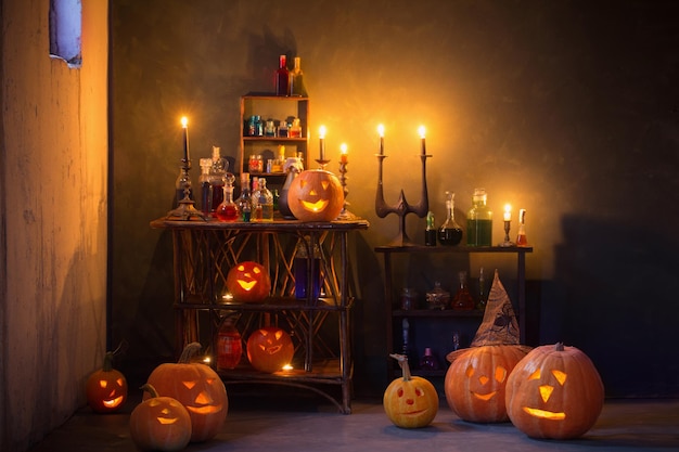 Halloween decoration with pumpkins and magic potions indoor