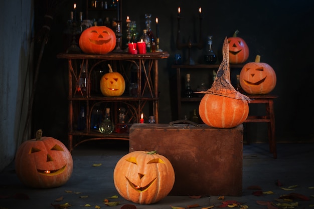 Halloween decoration with pumpkins and magic potions indoor