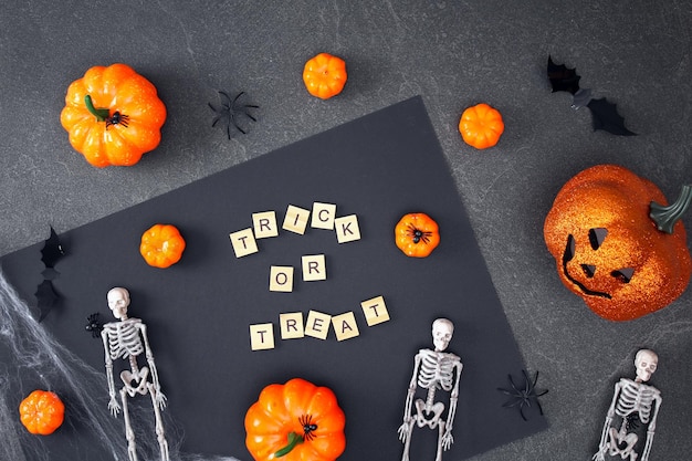 Halloween decorations on black background halloween concept flat lay top view trick or treat