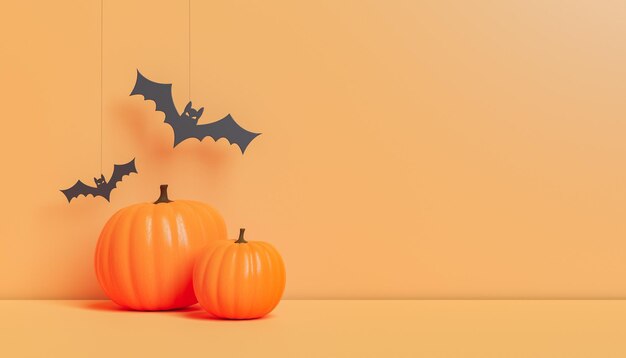 Halloween decorations with pumpkins and paper bats in studio