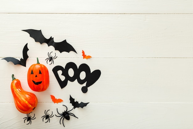 Halloween flat lay composition  with on white wooden background. Halloween holiday decorations