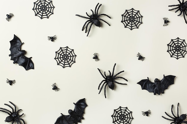 Halloween greeting card with bats spiderweb and spider