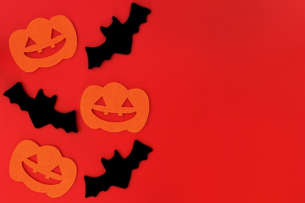 Halloween holiday decorations on red background