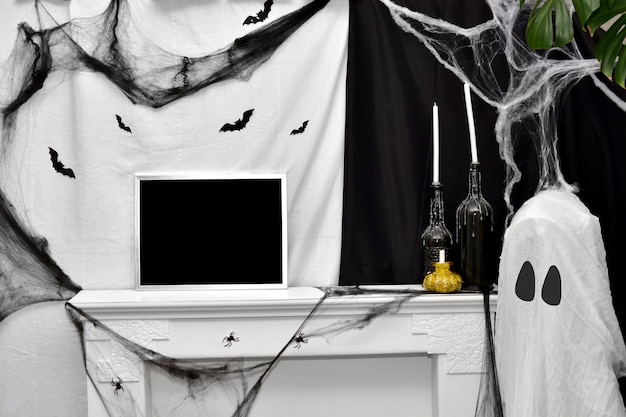 Photo halloween interior with fireplace bats ghost candles and cobwebs holiday decor place for text