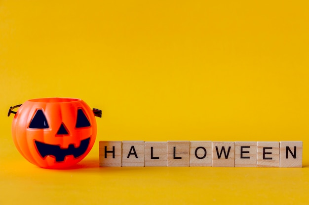 Halloween Jack o Lantern bucket with on yellow background