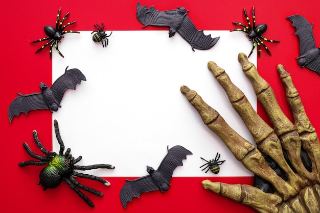 Halloween mock up blank sheet of paper with spiders bats and monsters hand