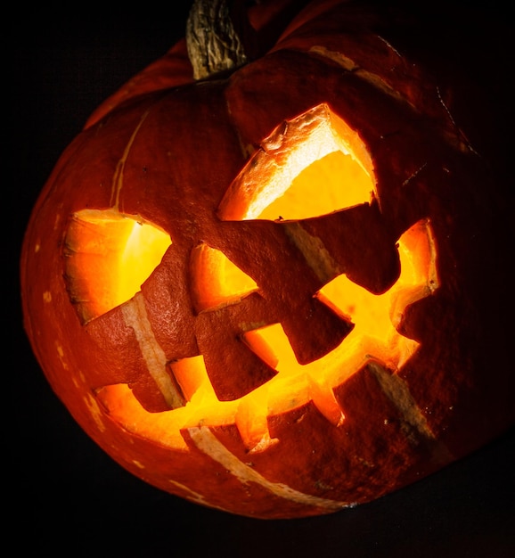 Halloween - old jack-o-lantern on black background