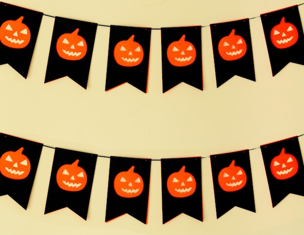 Halloween paper garland with spooky pumpkin background