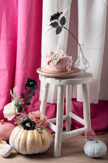 Halloween party decoration with pink cake