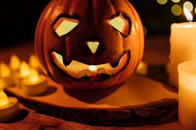 Halloween pumpkin orange light. Jack-o-lantern Background with candles and lights.