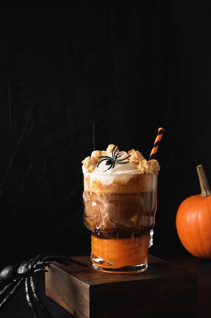 Halloween Pumpkin spice latte coffee with whipped cream decorated skulls