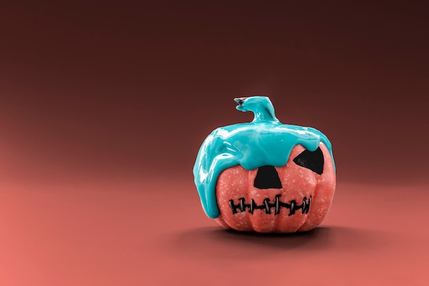 Halloween pumpkin with blue paint on a red background Creative Halloween concept