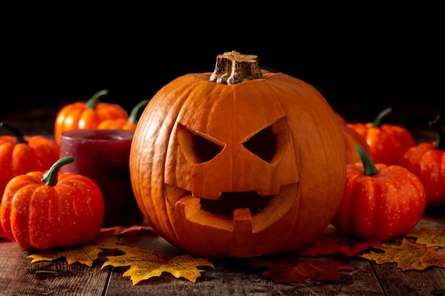 Halloween pumpkin on wooden table and black background