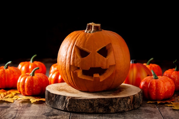 Halloween pumpkin on wooden table and black background