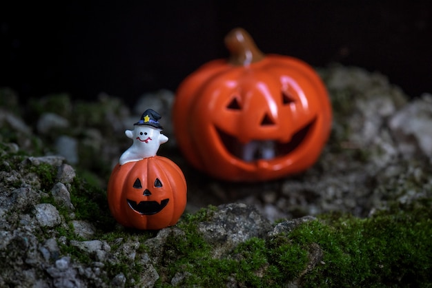 Halloween Pumpkins And Candles On Wooden